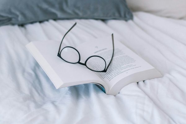 black framed eyeglasses on book page